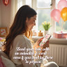 Smiling woman looking at her phone, enjoying her elegant personalized floral birthday video greeting.